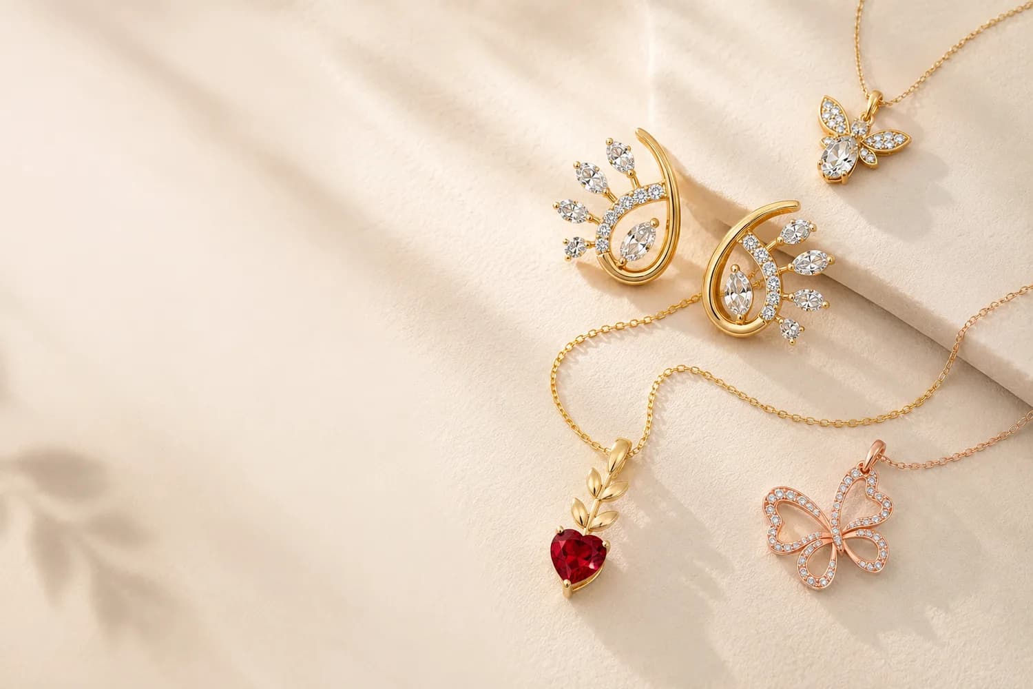 Gold butterfly and heart pendants with diamond earrings